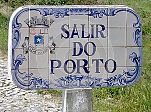 Typical city sign Salir in tile work photo