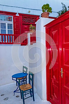 Nice red details of whitewashed villa street of Chora Mykonos Cyclades Greece
