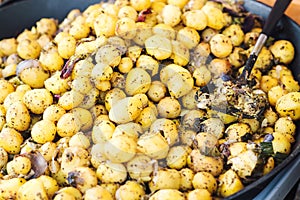 Traditional national czech street food , steamed potato with spices at seasonal fair.