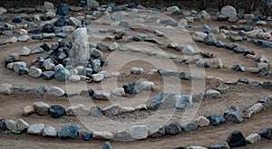 Traditional natural stone labyrinth maze made for contemplation and worship, created with rocks in shades of blue and turquoise