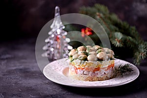 Traditional New Year`s Russian salad `Mushroom Glade` from boiled potatoes, carrots, eggs, smoked meat, soft cheese and marinated