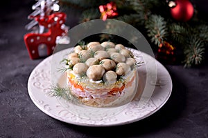 Traditional New Year`s Russian salad `Mushroom Glade` from boiled potatoes, carrots, eggs, smoked meat, soft cheese and marinated