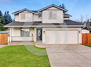 Traditional northwest home with driveway.