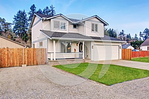 Traditional northwest home with driveway.