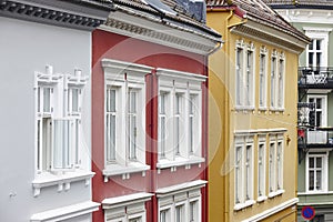 Traditional norwegian colored classic houses facades in Bergen.