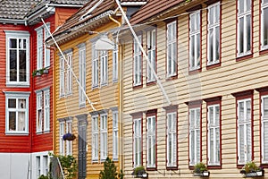 Traditional norwegian colored classic houses facades in Bergen.