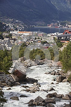 Traditional norwegian fjord village with river. Odda. Travel Nor