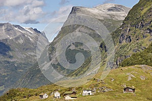 Traditional norwegian mountain landscape with old wooden houses.