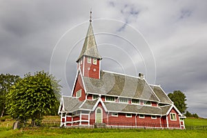 Traditional norwegian red stave church. Rodven. Travel Norway.