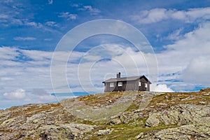 Traditional norwegian wooden house in Norway mountains