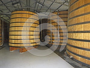 Traditional oak wood vats in rum distillery in Martinique, French West Indies. Large Oak Casks for the production of rum