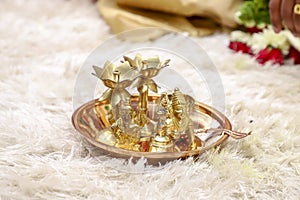 Traditional oil lamp and lord shri Krishna sculpture in plate