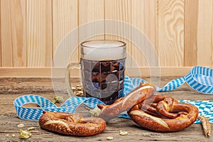 Traditional Oktoberfest set. Pretzels and beer, German festival food concept. Trendy hard light photo