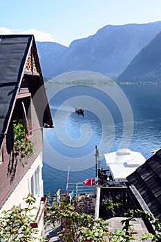 Traditional old austrian wooden house in Hallstatt, Austria. The roof of the house on the background of the Austrian mountains.