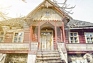 Traditional old house in Zdiar village, Slovakia, yellow sun ray