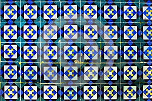 Traditional old porcelain ceramic tile azulejo on the facade of