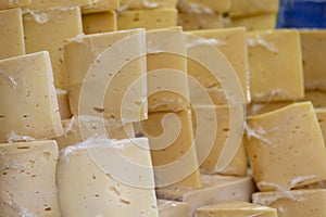 Traditional Old Sliced Turkish Kars cheddar cheese and cheese blocks are for sale on merchant