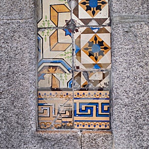 Traditional old tiles wall on the street Portuguese painted tin-glazed, azulejos ceramic tilework.