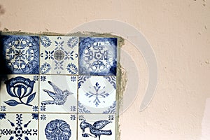 Traditional old tiles wall on the street Portuguese painted tin-glazed, azulejos ceramic tilework.