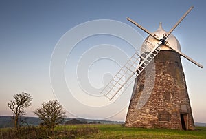 Traditional old windmill at sunset