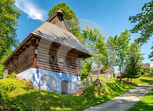 Traditional old wooden cottage with blue facade in village Srnacie - Dolny Kubin, Slovakia