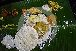 Traditional Onam Sadhya or Onam Feast. Traditional South Indian food served in Banana Leaf