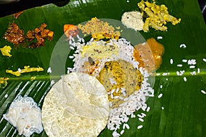 Traditional Onam Sadhya or Onam Feast. Traditional South Indian food served in Banana Leaf