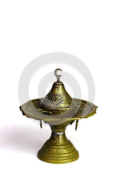Traditional Oriental incense burners, candlesticks, lamp isolated on a white background. Muslim style.