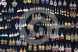 traditional oriental Uzbek earrings in Indian Asian ethnic style on a black background