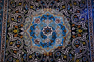 Traditional ornaments and patterns on a blue background in Iranian mosques