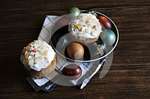 Traditional Orthodox Easter bread the kulich, russian food, religion, painted eggs, candle.Flat lay.