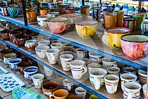 Traditional painted ceramic dishes for sale at a city centre shop Crete, Greece, Europe.