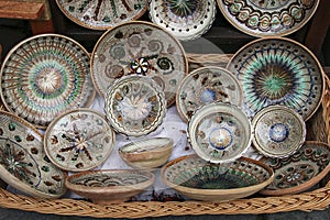 Traditional painted ceramic dishes for sale on one of the markets in Sighisoara, Romania