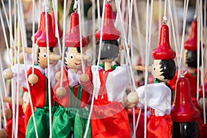 Traditional painted red and green wooden Pinocchio marionette dolls Italy