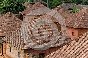 Traditional palace of the Fon of Bafut with brick and tile buildings and jungle environment, Cameroon, Africa