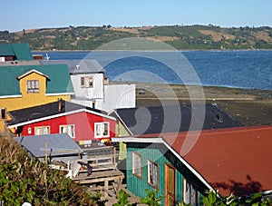 Traditional palafitos houses on woodem columns in chiloe photo