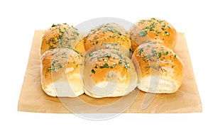 Traditional pampushka buns with garlic and herbs on white background