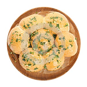 Traditional pampushka buns with garlic and herbs on white background, top view