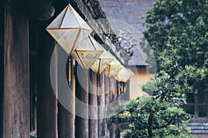 Traditional paper lanterns of Hue city getting wet under monsoon rain in Vietnam