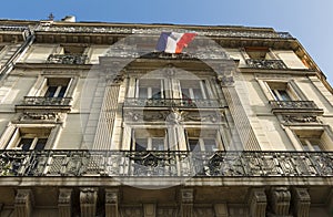 Traditional parisian house with balconies and exposed french fl