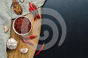 Traditional pasta with hot chilli sauce Maghreb, harissa on a dark slate background, Tunisian cuisine, Arabic, Mexican cuisine,