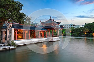 Traditional pavilion and promenade at dusk