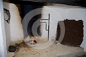 A traditional peat turf fire in an open fireplace.