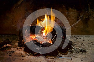 A traditional peat turf fire in an open fireplace.