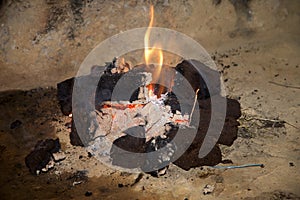 A traditional peat turf fire in an open fireplace.