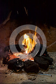 A traditional peat turf fire in an open fireplace.