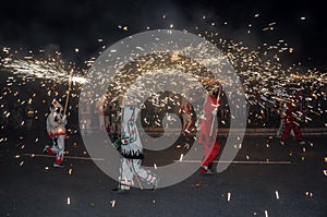 Traditional performance called correfocs (fire runs). Reus, Spain. photo