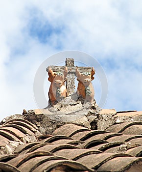 Traditional Peruvian bulls Toritos de Pucara on a roof photo