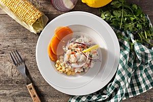 Traditional peruvian ceviche with fish, sweet potato, corn and vegetables