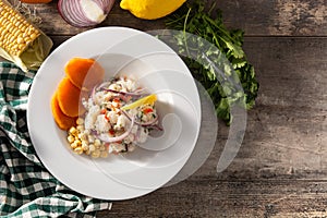 Traditional peruvian ceviche with fish, sweet potato, corn and vegetables